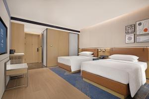 Postelja oz. postelje v sobi nastanitve Four Points by Sheraton Chengdu, Chunxi Road