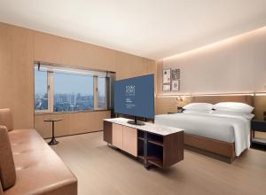Postelja oz. postelje v sobi nastanitve Four Points by Sheraton Chengdu, Chunxi Road