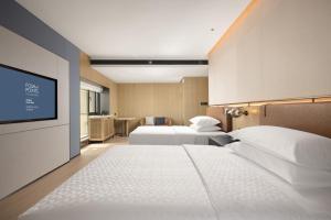 Postelja oz. postelje v sobi nastanitve Four Points by Sheraton Chengdu, Chunxi Road