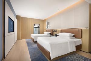 Postelja oz. postelje v sobi nastanitve Four Points by Sheraton Chengdu, Chunxi Road