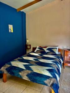 Postel nebo postele na pokoji v ubytování Zompopa Lodge