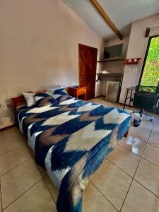 Postel nebo postele na pokoji v ubytování Zompopa Lodge