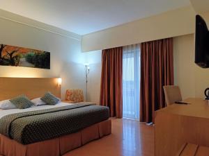 Postel nebo postele na pokoji v ubytování Lux Tychi Hotel