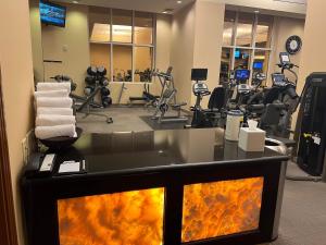 a fitness room with a gym with tread machines at MGM Signature - NO FEEs, Free Valet, Lazy river View in Las Vegas