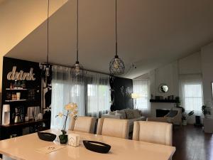 a kitchen and living room with a table and chairs at Spacious Home Steps from Huge Park and Outdoor Fun in San Jose