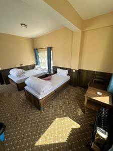 Hotel Siddhartha & Khanglo Thakali Bhancha Ghar客房内的一张或多张床位