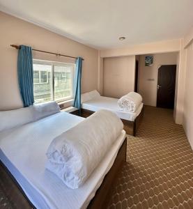 Hotel Siddhartha & Khanglo Thakali Bhancha Ghar客房内的一张或多张床位