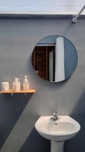 a bathroom with a sink and a mirror at Pi Noong Homestay in Lan Hung
