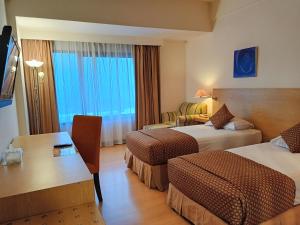 Postel nebo postele na pokoji v ubytování Lux Tychi Hotel
