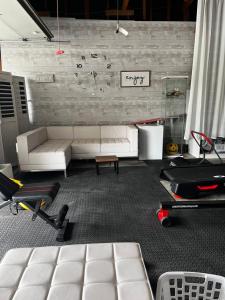 a living room with a white couch and chairs at Spacious Home Steps from Huge Park and Outdoor Fun in San Jose