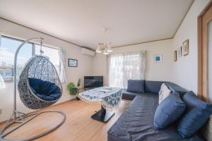 TV a/nebo společenská místnost v ubytování OKINAWA Arena Hotel