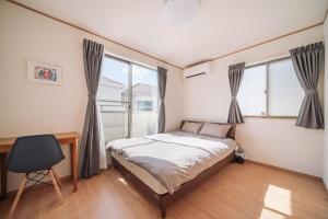 Postel nebo postele na pokoji v ubytování OKINAWA Arena Hotel