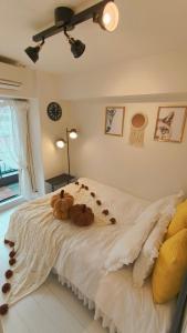 a bedroom with two teddy bears on a bed at Stunning luxury APT with balcony in Tokyo Shinjuku Kabukicho in Tokyo