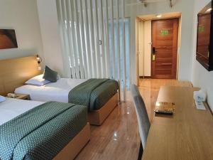 Postel nebo postele na pokoji v ubytování Lux Tychi Hotel