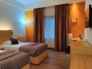 Postel nebo postele na pokoji v ubytování Lux Tychi Hotel