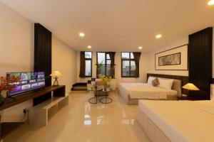 Μια τηλεόραση ή/και κέντρο ψυχαγωγίας στο Anpha Apartment Hotel Ben Thanh