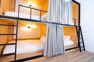 Voodi või voodid majutusasutuse Chao Hostel toas