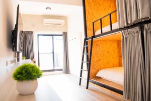 Voodi või voodid majutusasutuse Chao Hostel toas