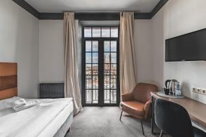 TV a/nebo společenská místnost v ubytování Aparthotel Stara Przędzalnia