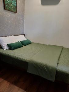 Ein Bett oder Betten in einem Zimmer der Unterkunft Boom Casa Homestay