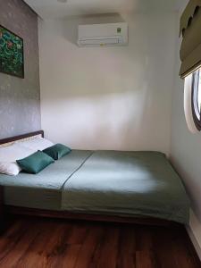 Ein Bett oder Betten in einem Zimmer der Unterkunft Boom Casa Homestay