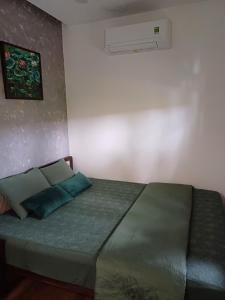 Ein Bett oder Betten in einem Zimmer der Unterkunft Boom Casa Homestay
