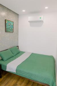 Ein Bett oder Betten in einem Zimmer der Unterkunft Boom Casa Homestay