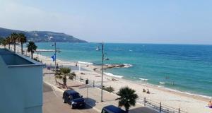 a view of a beach with people and the ocean at Casa Almyrà Costa dei trabocchi in Fossacesia