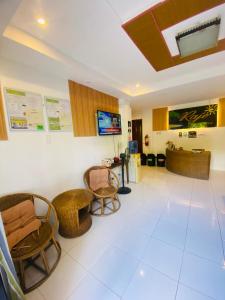a waiting room at a hospital with chairs and a desk at Raje Residence in El Nido