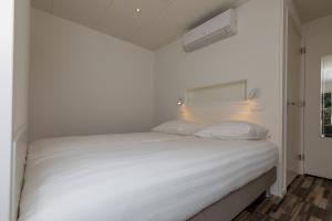 Ένα ή περισσότερα κρεβάτια σε δωμάτιο στο Appartementen Renesse