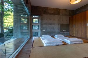 Postel nebo postele na pokoji v ubytování Chuying Sunrise B&B