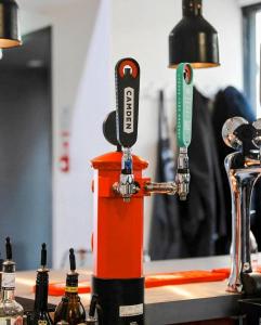 an orange and black machine sitting on a counter at Top Floor Apt Promenade Sea Views Sleeps 6 Shore Vibes in Morecambe