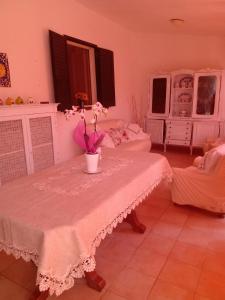 a room with a table with flowers on it at Gioia House in Rome +6 photos