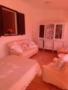 a room with two beds and a dresser in it at Gioia House in Rome