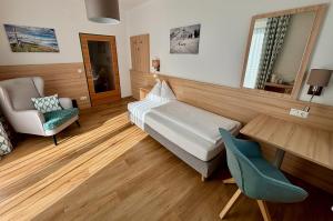 Postel nebo postele na pokoji v ubytování Haus Friedrichsburg - Bergbahnen von Mai bis November inklusive