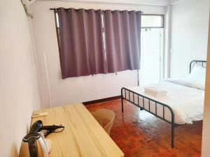 Ένα ή περισσότερα κρεβάτια σε δωμάτιο στο Stay On Maya Chiang Mai - สเตย์ ออน เมญ่า เชียงใหม่