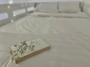 Postel nebo postele na pokoji v ubytování Moc Nha Minh Hotel Da Lat