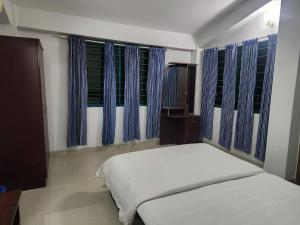 Postel nebo postele na pokoji v ubytování Neelima Resort + 23 fotografií