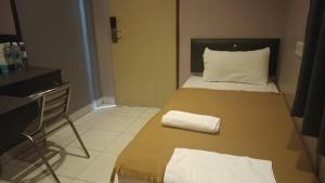 En eller flere senger på et rom på CK Hotel