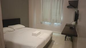 En eller flere senger på et rom på CK Hotel