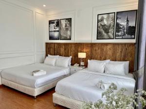 Postel nebo postele na pokoji v ubytování Moc Nha Minh Hotel Da Lat