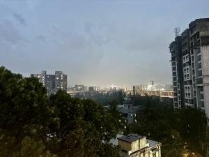 a view of a city with tall buildings at Vibrant 2 BHK Apartment Near Airport in Mumbai