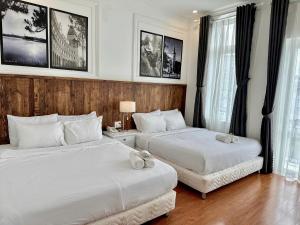 Postel nebo postele na pokoji v ubytování Moc Nha Minh Hotel Da Lat