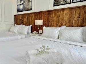 Postel nebo postele na pokoji v ubytování Moc Nha Minh Hotel Da Lat