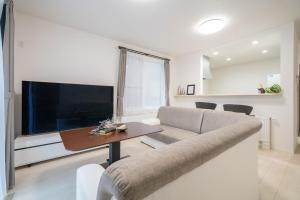 TV a/nebo společenská místnost v ubytování Lumiere Enclave