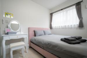 Postel nebo postele na pokoji v ubytování Lumiere Enclave