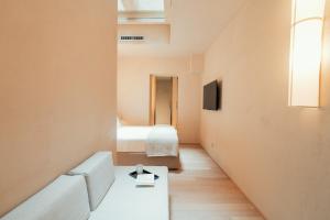 a small room with a bed and a couch at Velvet Grey Boutique Hotel Roma in Rome