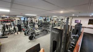 a gym with a lot of equipment in it at Norton Suite - Christchurch Central in Christchurch