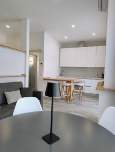 a kitchen and living room with a table and chairs at La Cittadella ex WAVA Spa in Brugnato