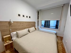 En eller flere senge i et værelse på Pensión Miramar